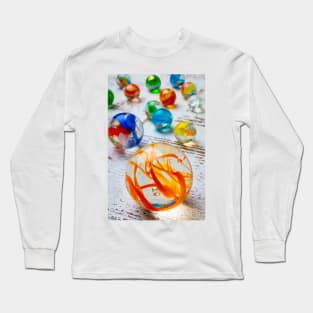 Glass Marbles On White Wooden Board Long Sleeve T-Shirt